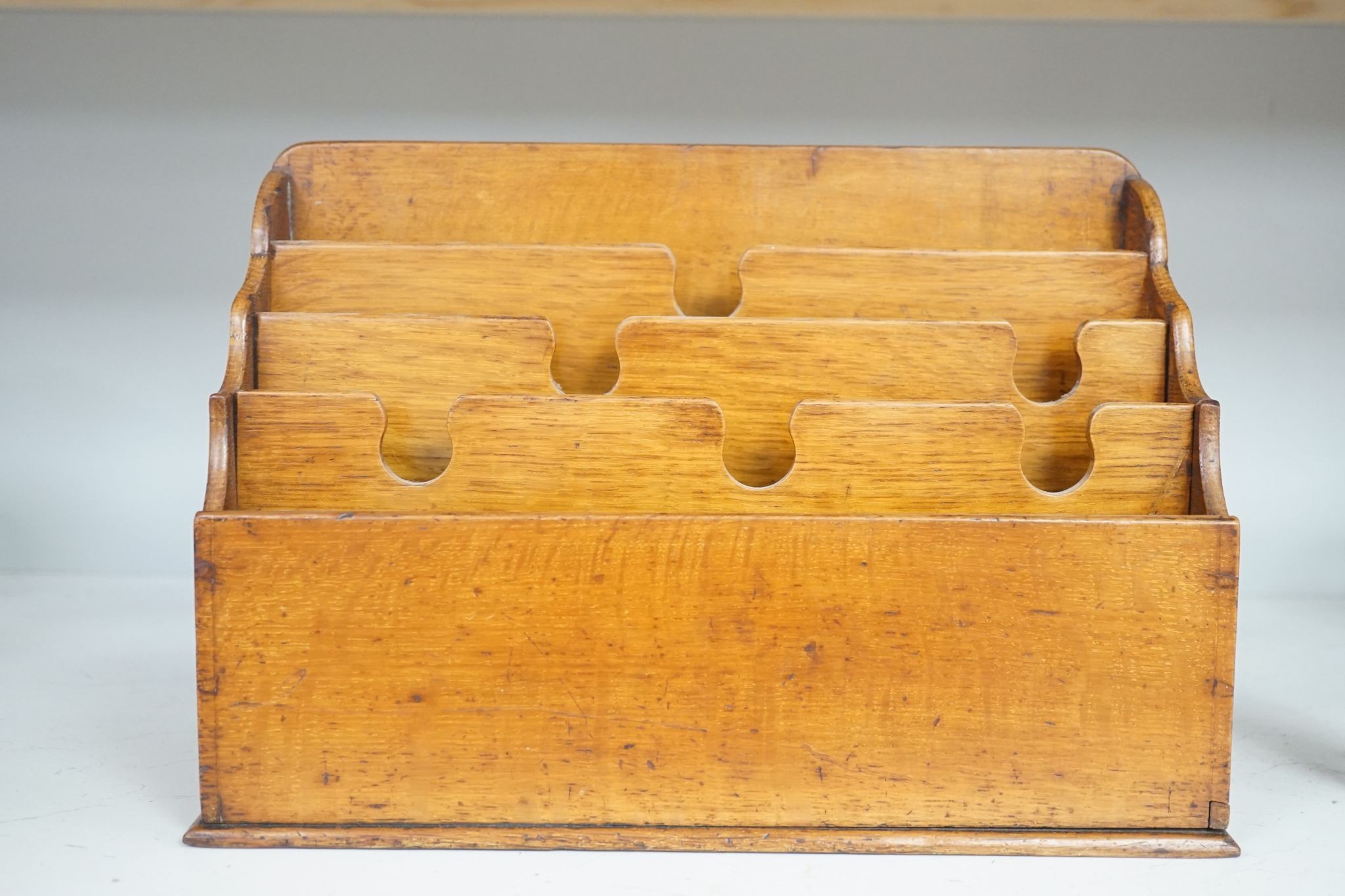 An Edwardian Morocco leather lined oak stationery box and letter rack 36cm